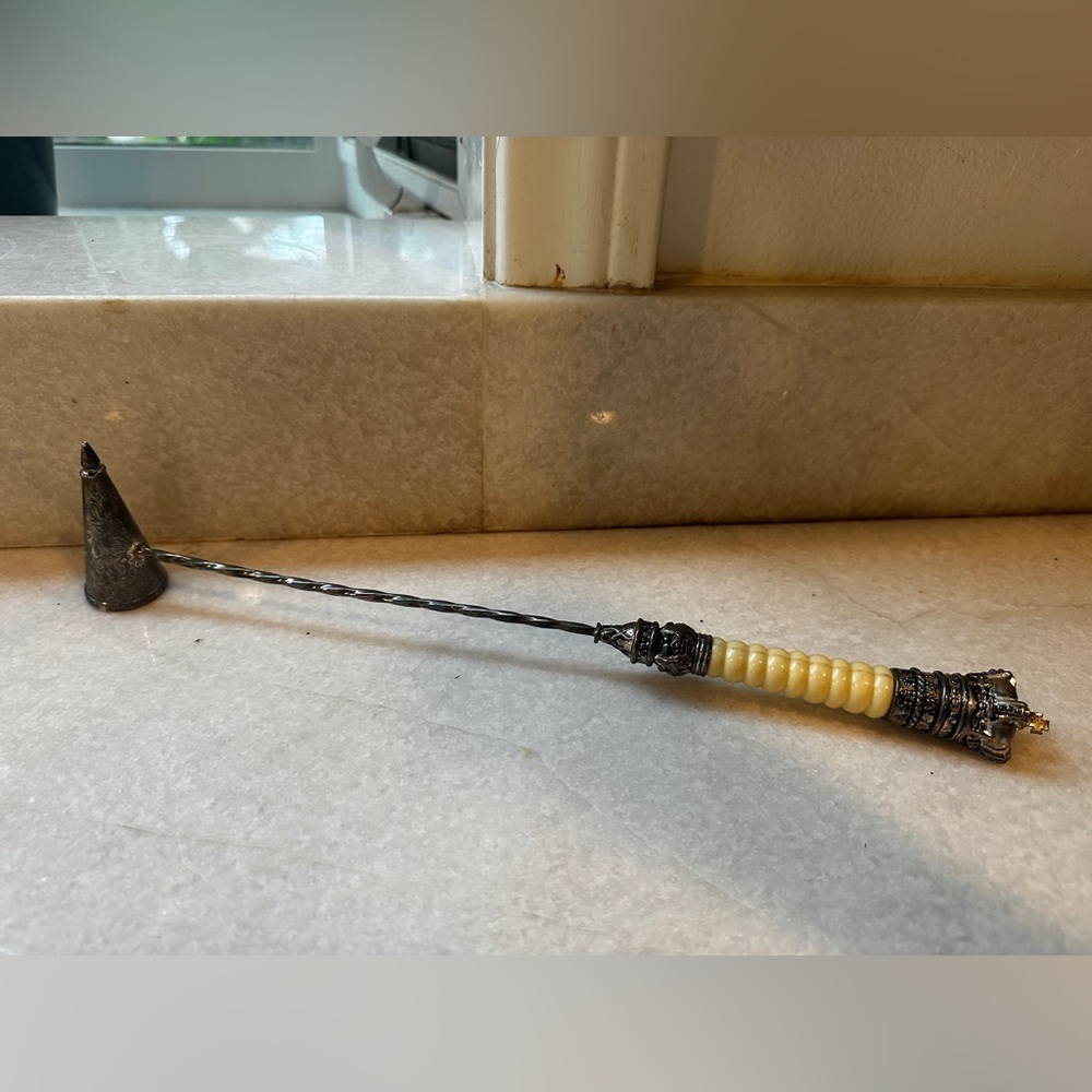 Vintagee international silvere company silver plated candle snuffer.